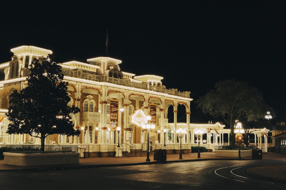 a large building lit up at night with christmas lights