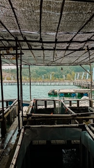 a view of a dock with boats in the water