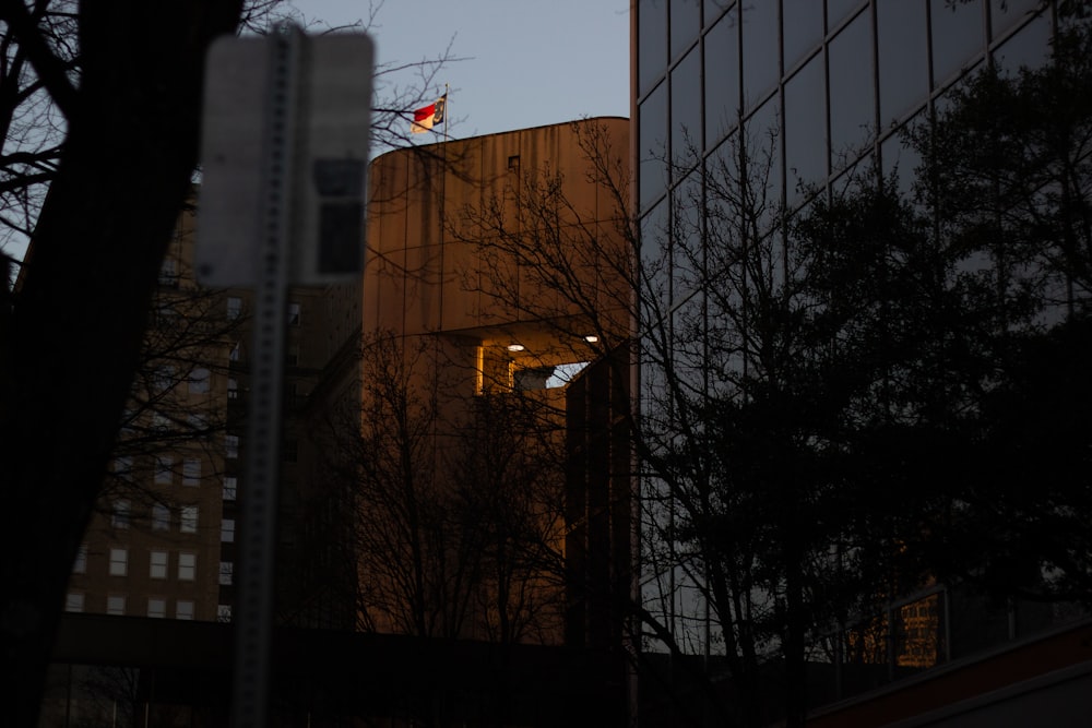 a tall building with a flag on top of it