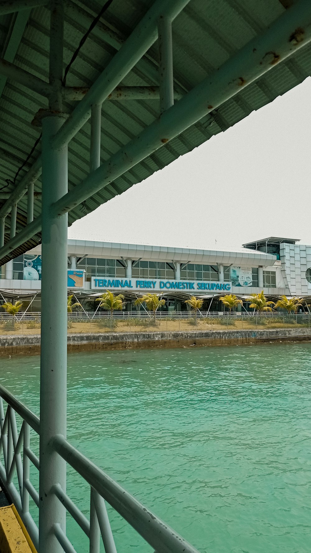 a train traveling down tracks next to a body of water