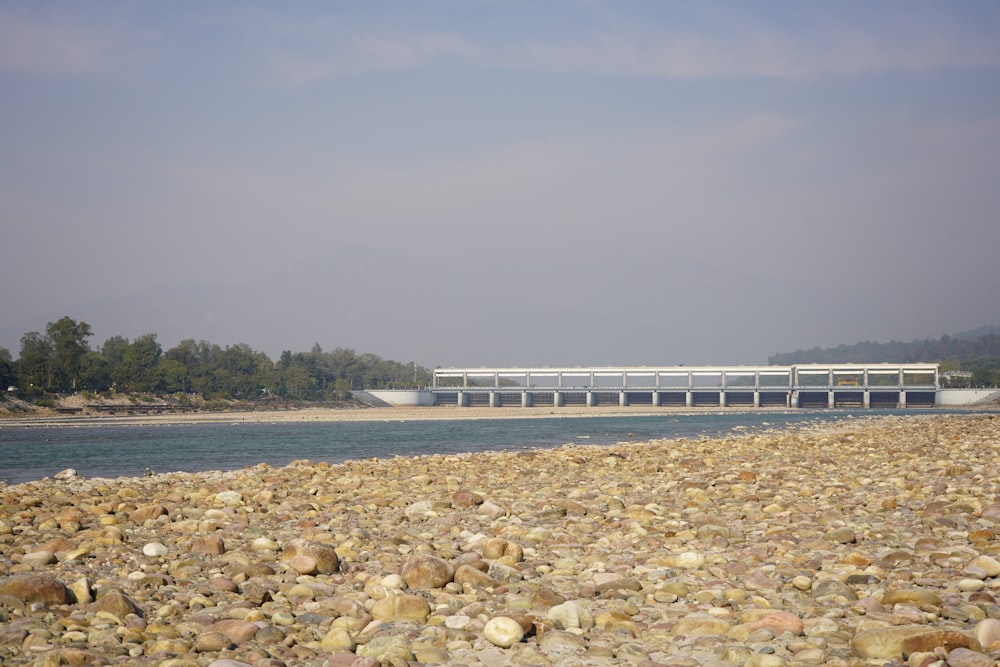 a bridge over a body of water surrounded by rocks