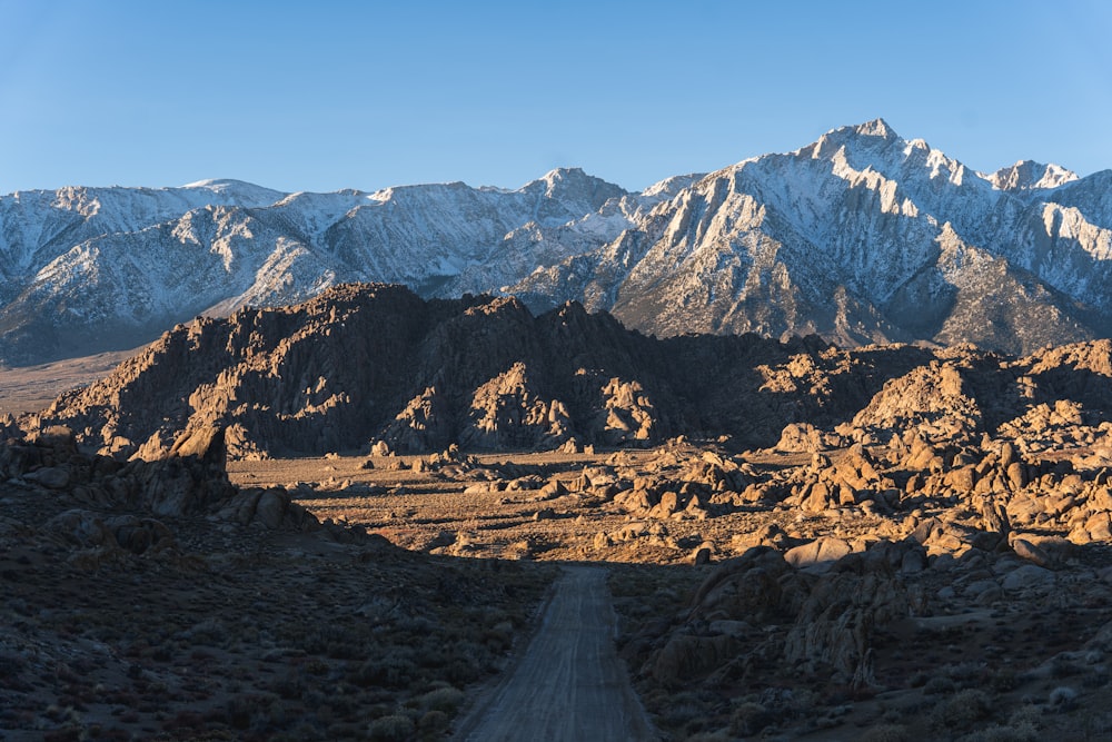 a dirt road in the middle of a mountain range