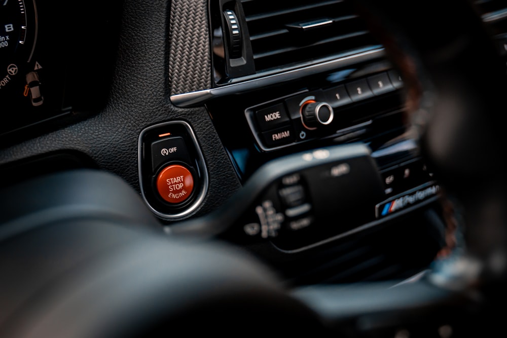 a close up of a car dashboard with a steering wheel