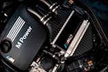 a close up of a car engine with its hood up
