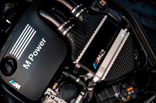 a close up of a car engine with its hood up