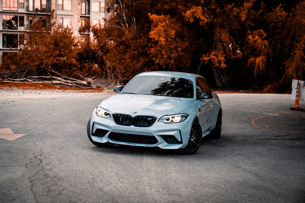 a blue car parked in a parking lot