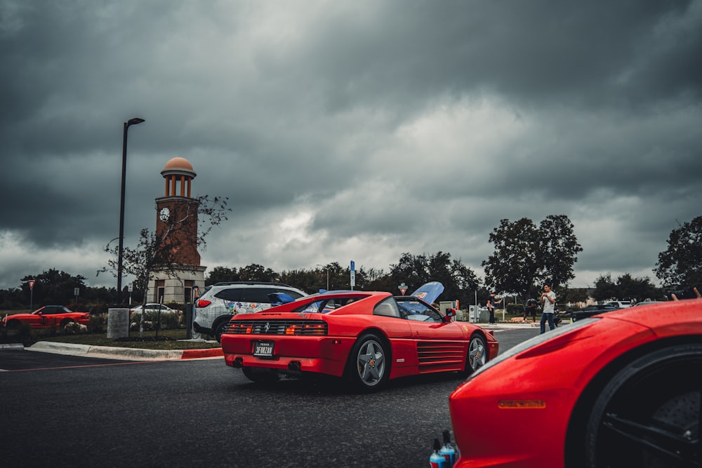 a red sports car parked in a parking lot