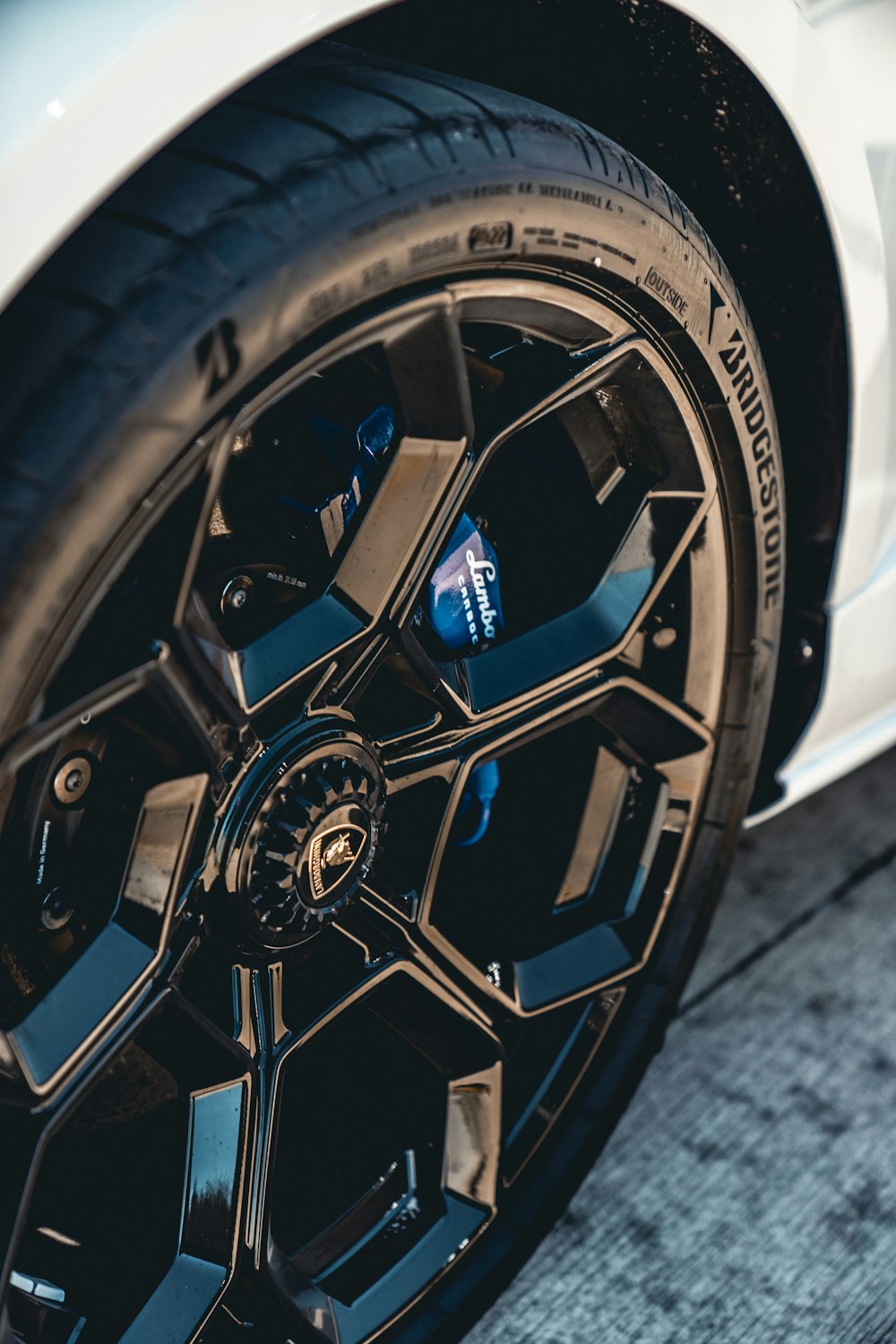 a close up of a tire on a sports car