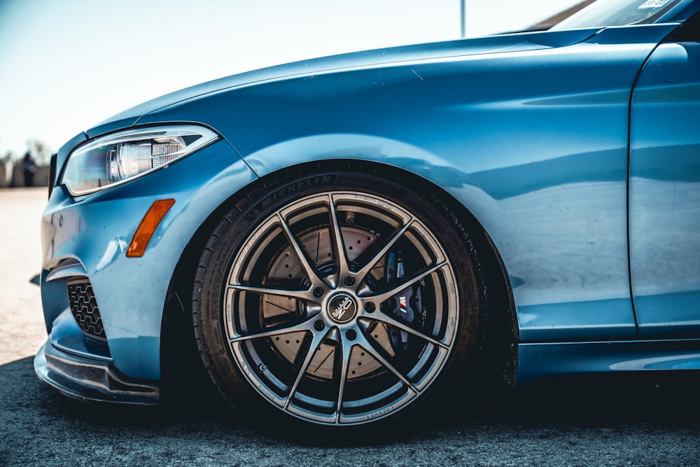 a close up of a blue sports car