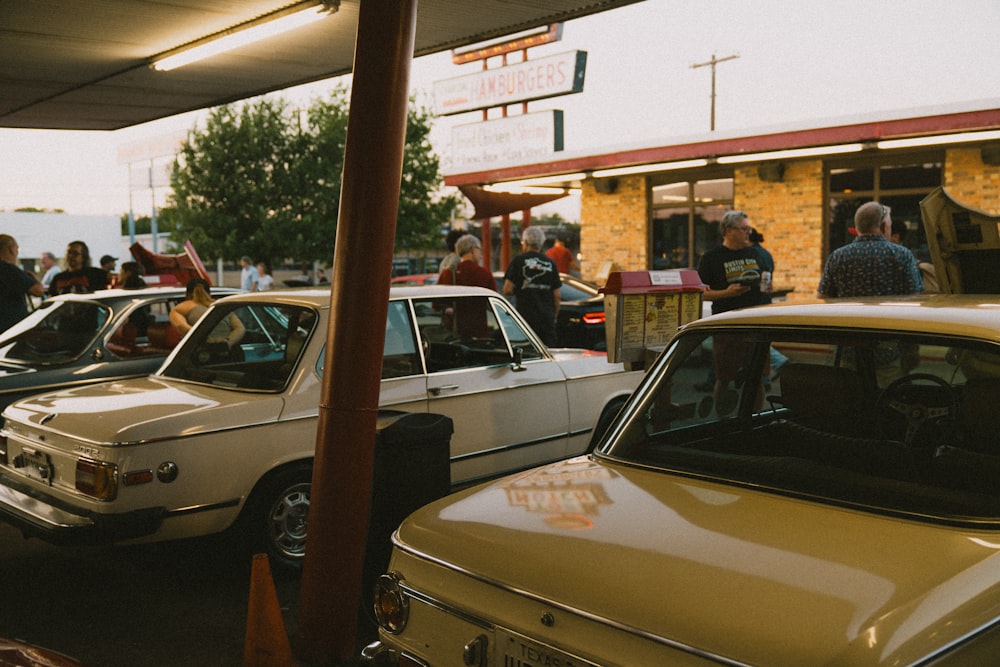 a group of cars parked next to each other in a parking lot