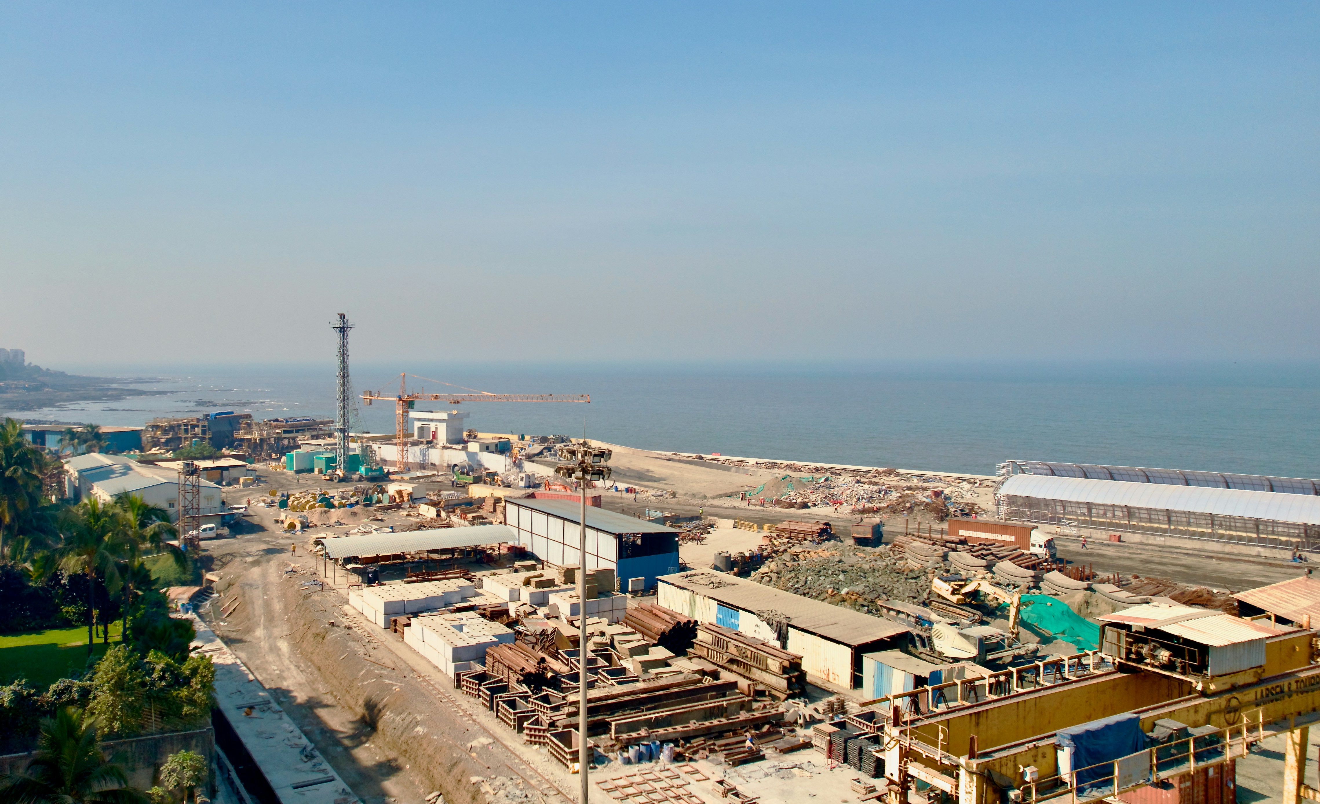 a view of a construction site next to the ocean