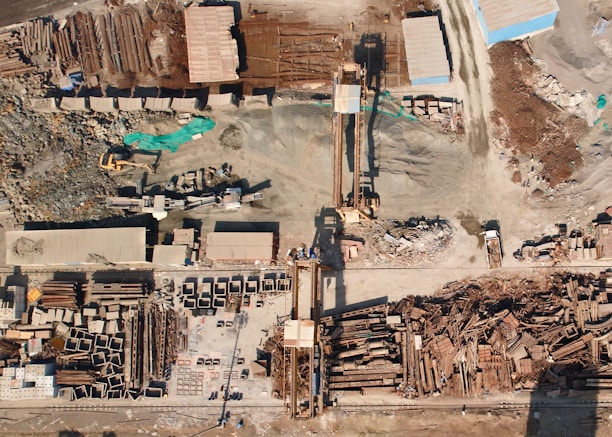 an aerial view of a construction site with a crane