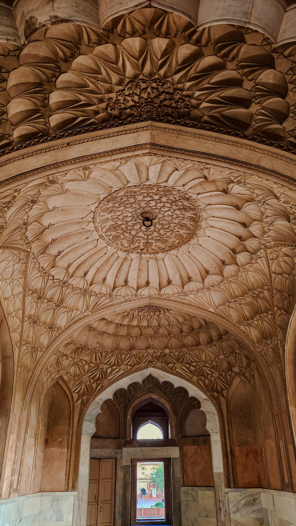 a doorway in a building with a decorative ceiling