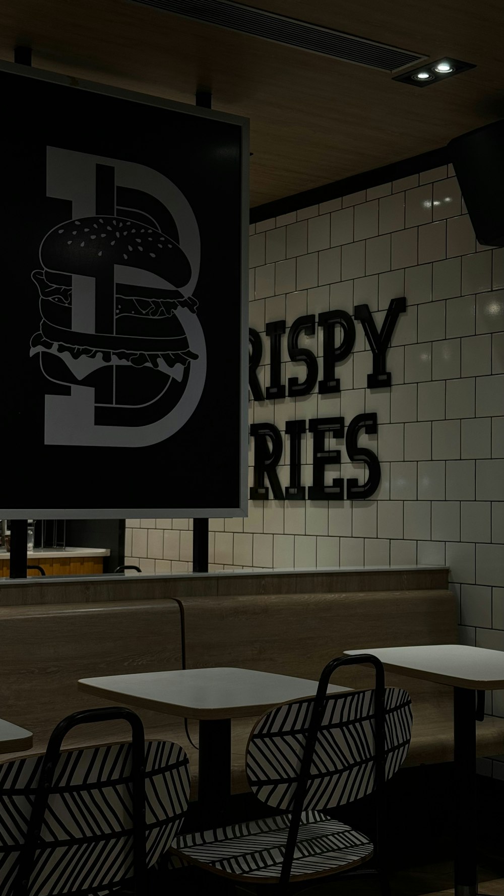 a restaurant with a sign that says crispy fries