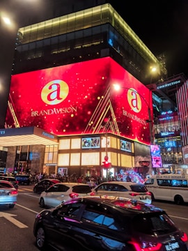 a large building with a lot of cars parked in front of it