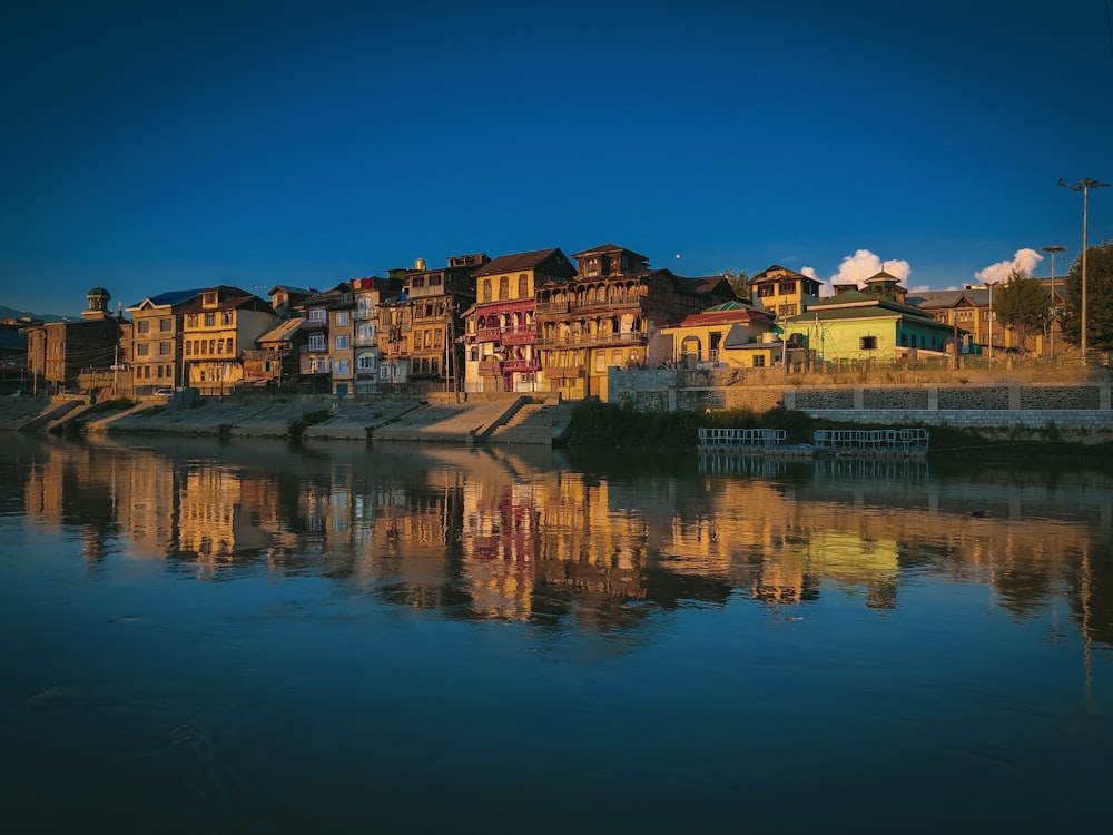 a row of houses next to a body of water