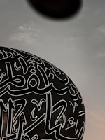 a large black object with white writing on it
