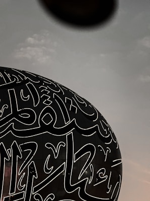 a large black object with white writing on it