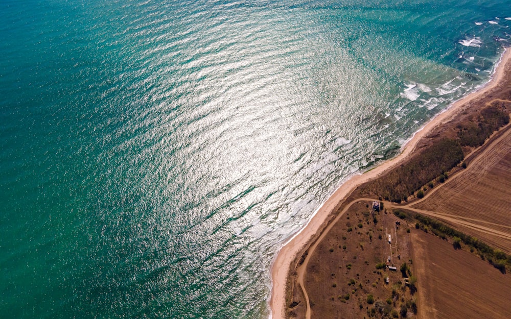 an aerial view of a beach and a body of water