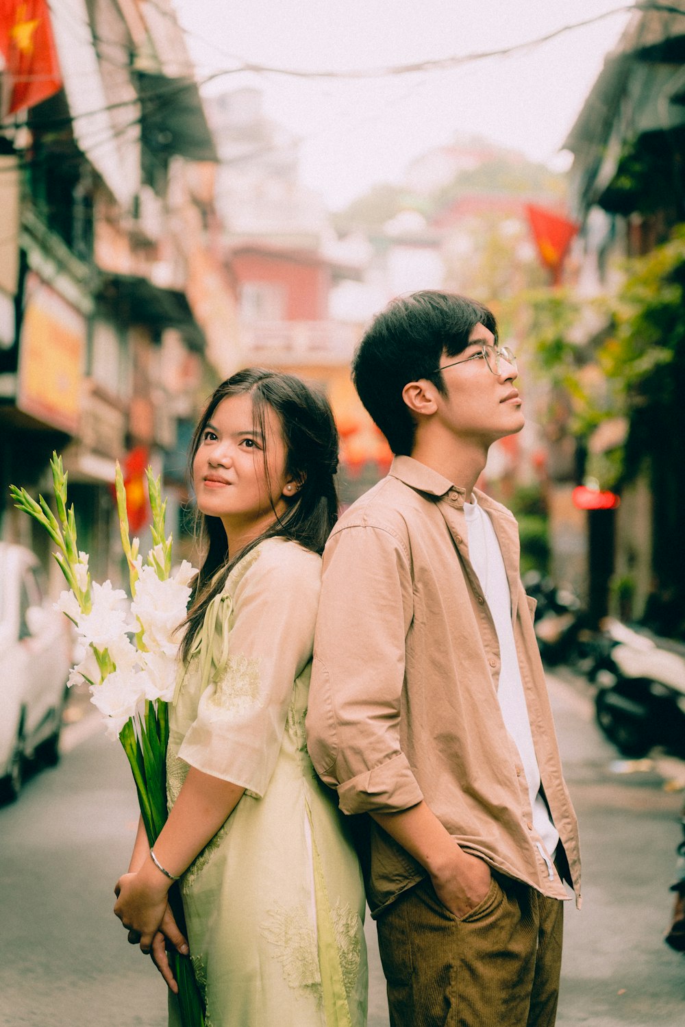 a man and a woman standing on a street