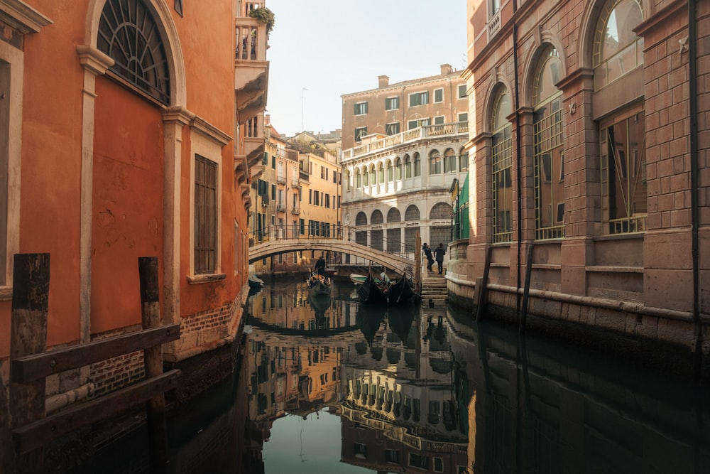 a canal with a bridge in the middle of it