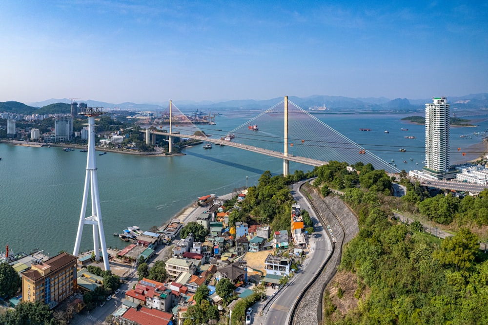 an aerial view of a bridge spanning the width of a large body of water