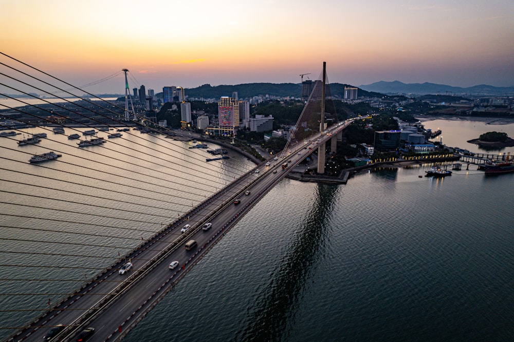 an aerial view of a bridge over a body of water