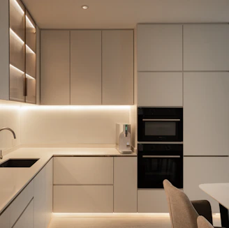 a kitchen with a table and chairs and a stove