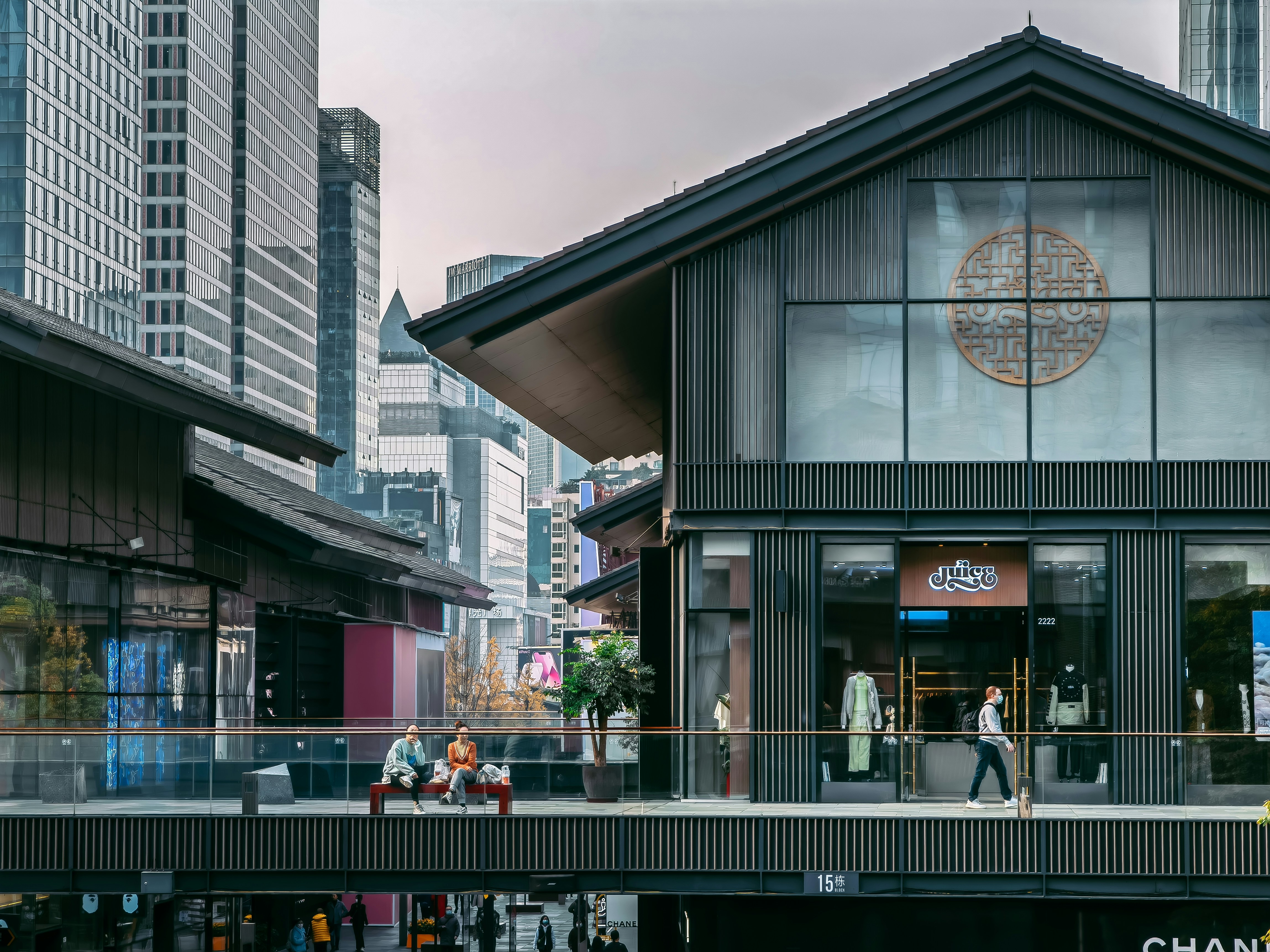 a group of people walking in front of a building
