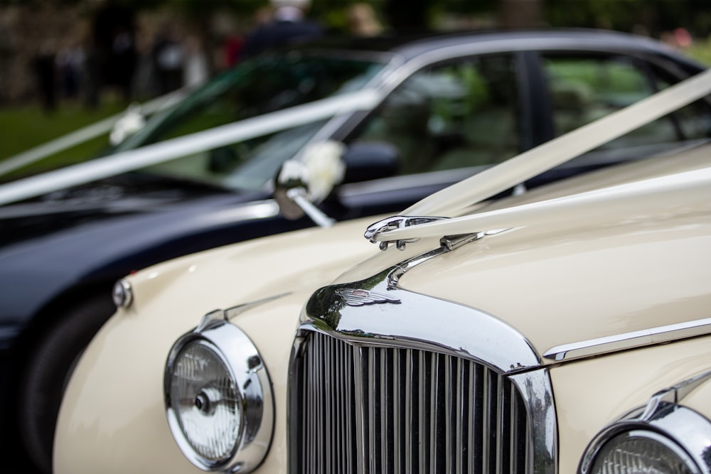 a row of classic cars parked next to each other