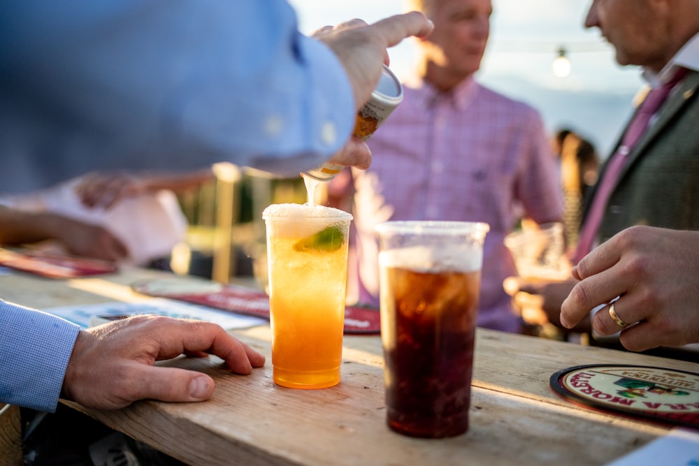 a group of people sitting at a table with drinks