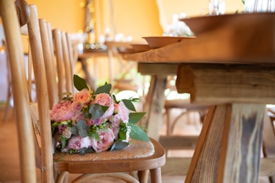 a bouquet of flowers is sitting on a chair