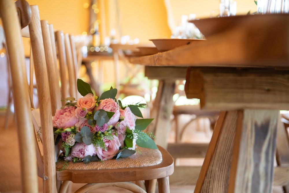 a bouquet of flowers is sitting on a chair
