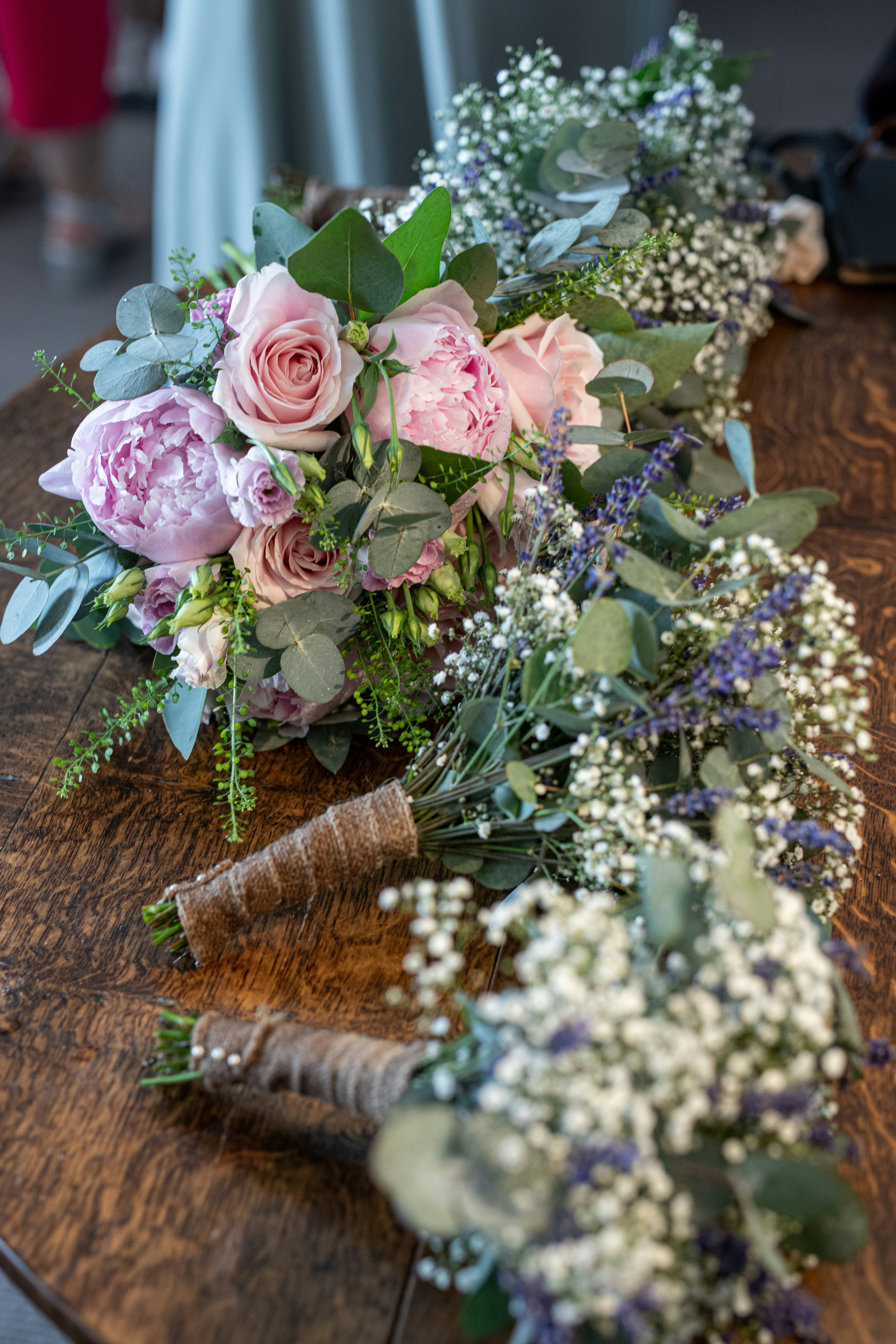 a bunch of flowers sitting on top of a wooden table