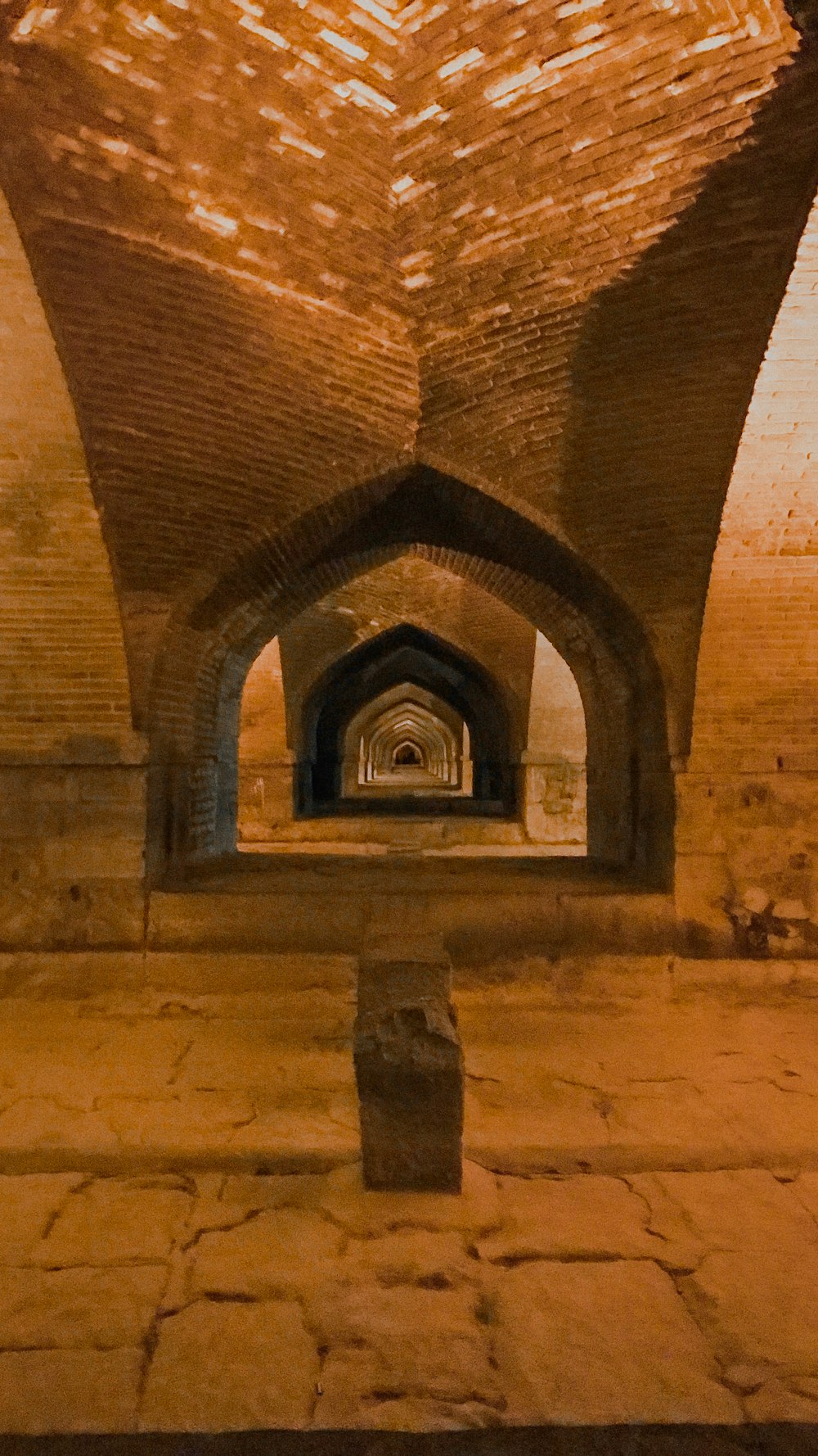 a tunnel with a clock on the side of it