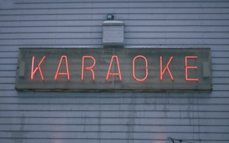 a neon sign on the side of a building