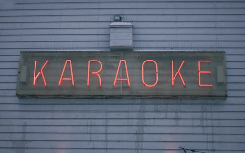 a neon sign on the side of a building