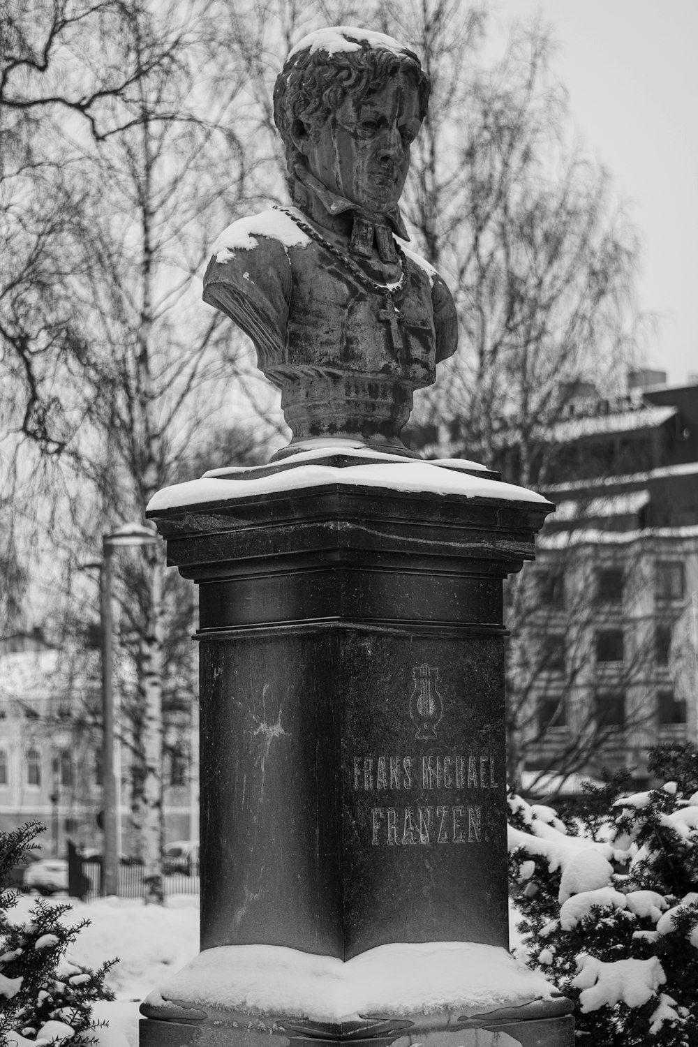 a black and white photo of a bust of a man