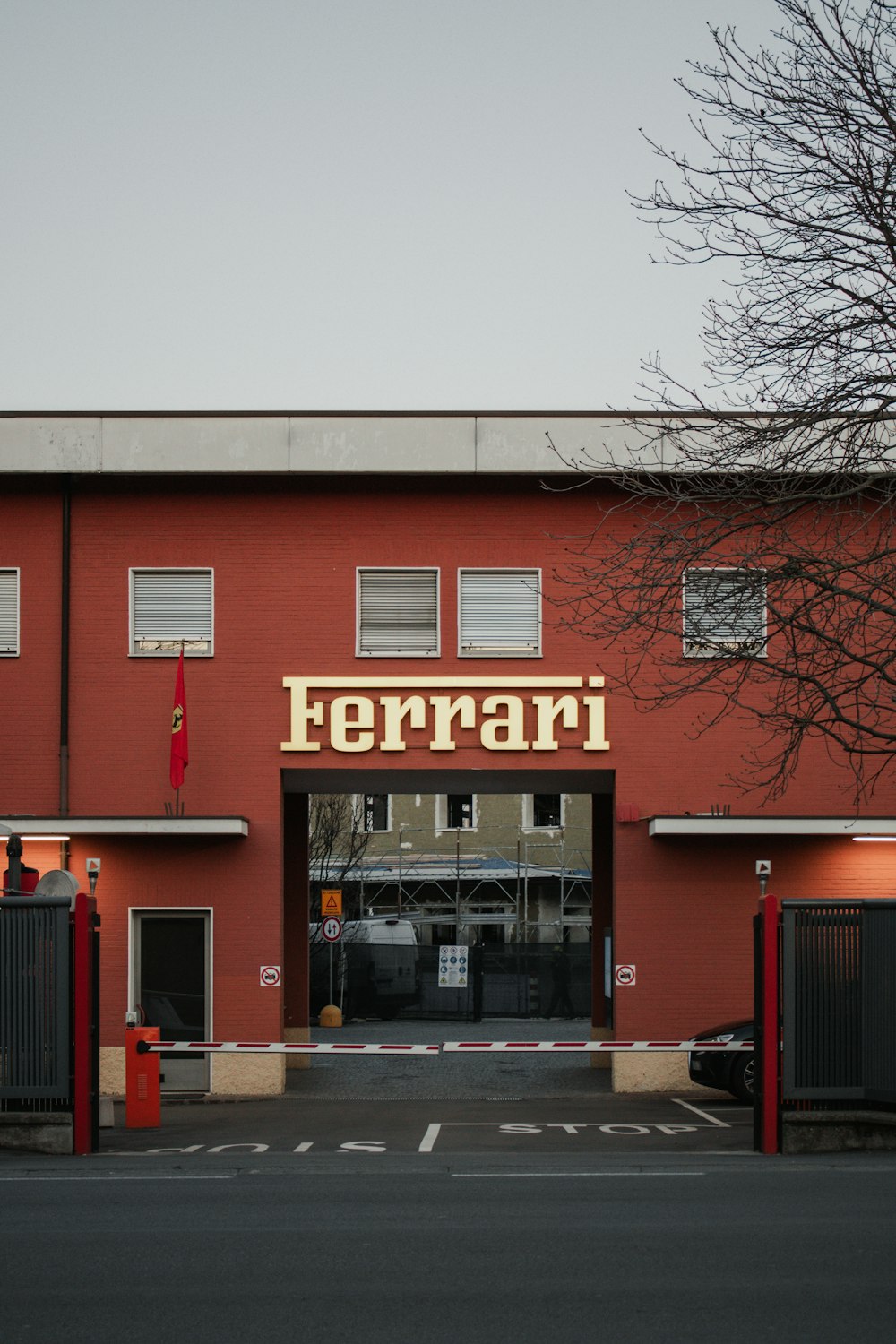 a red building with a sign on the front of it