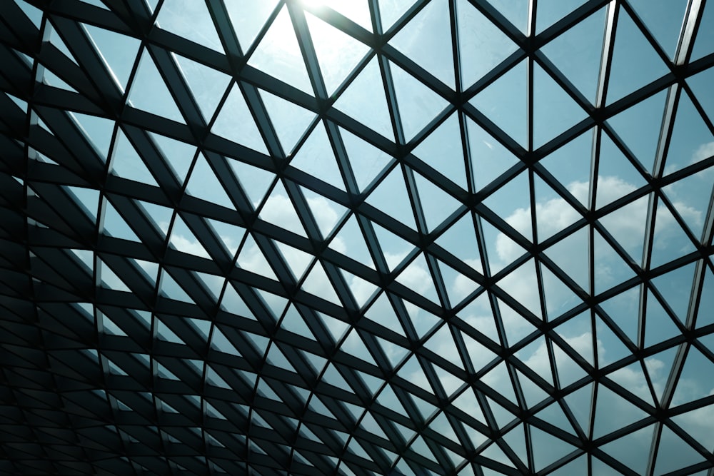 a view of the sky through a metal structure