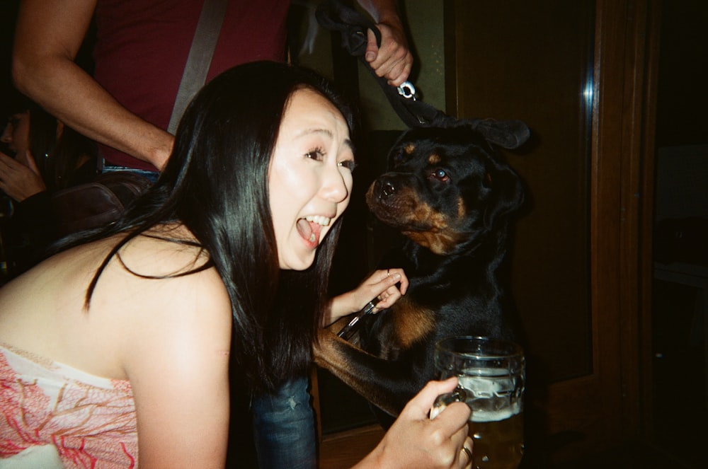 a woman holding a dog in her lap