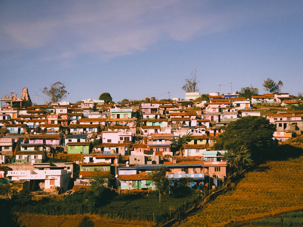 a large group of houses sitting on top of a hill