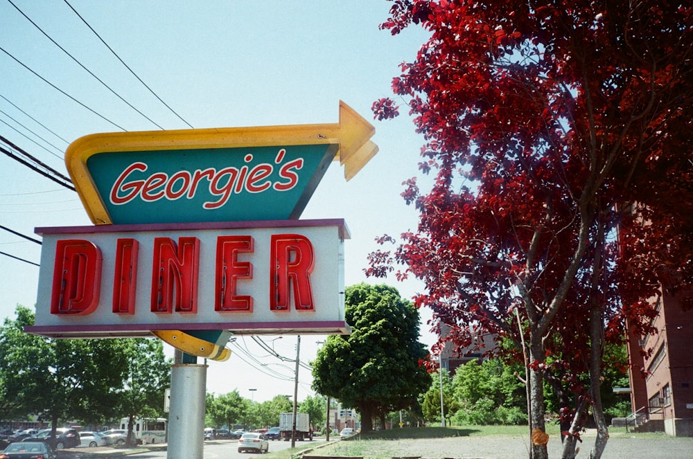 a large neon sign advertising a diner