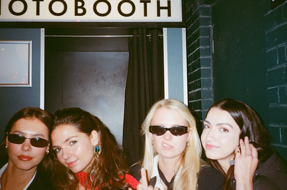 a group of women standing next to each other