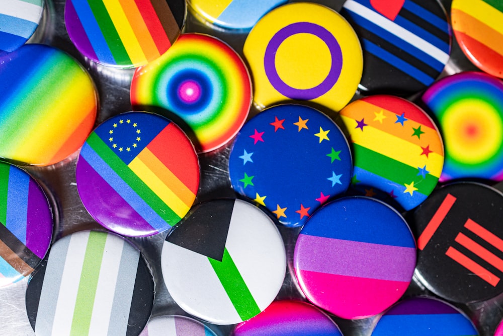 a bunch of different colored buttons on a table