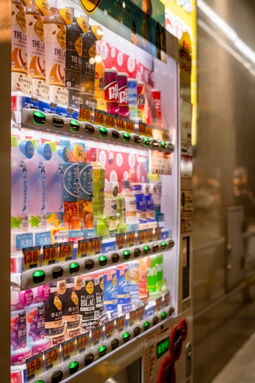 a vending machine with a variety of drinks on it