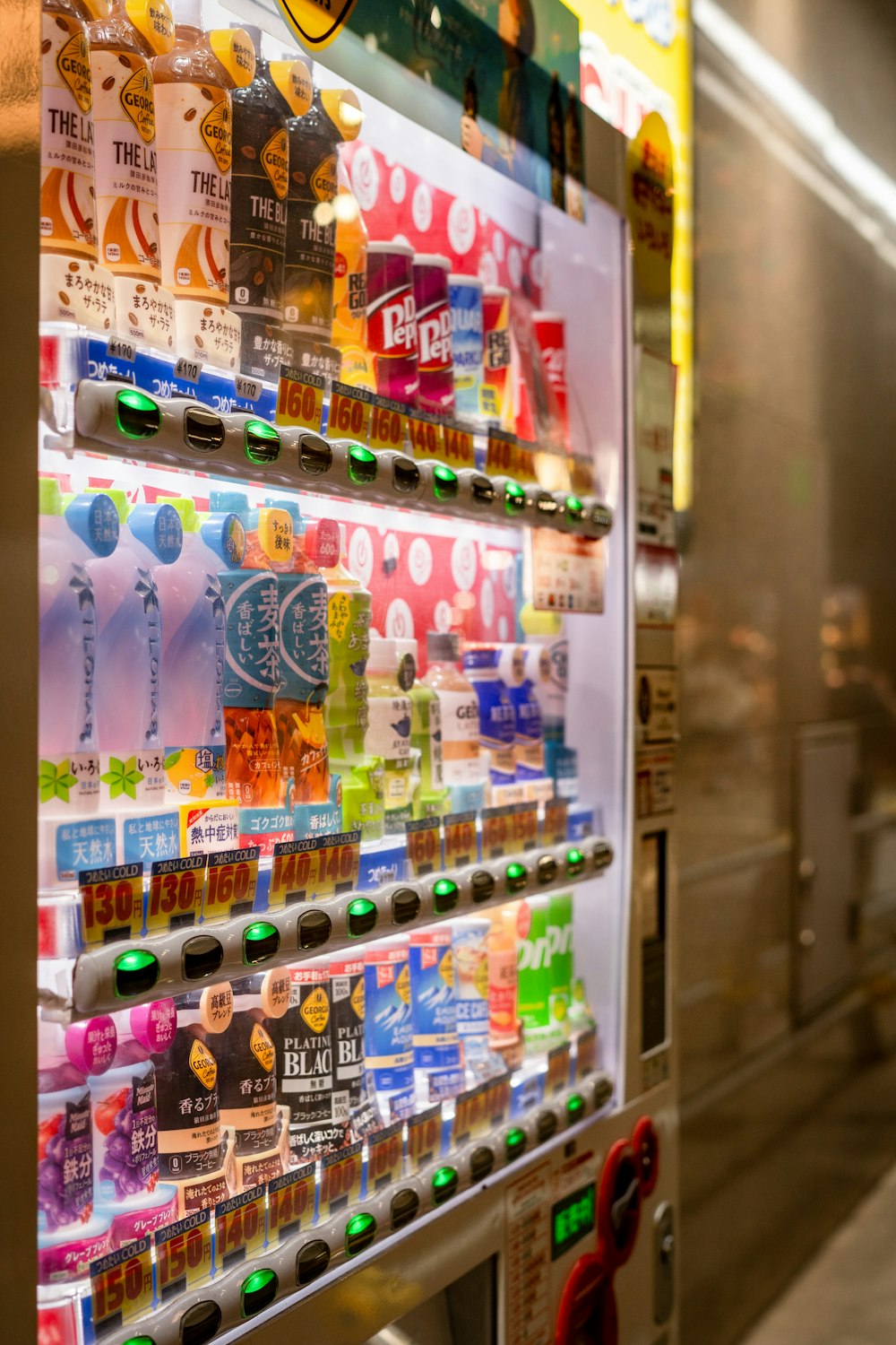 a vending machine with a variety of drinks on it