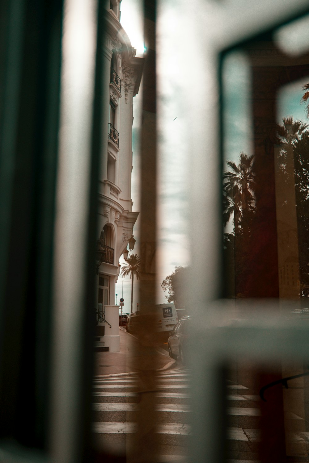 a view of a clock tower through a window