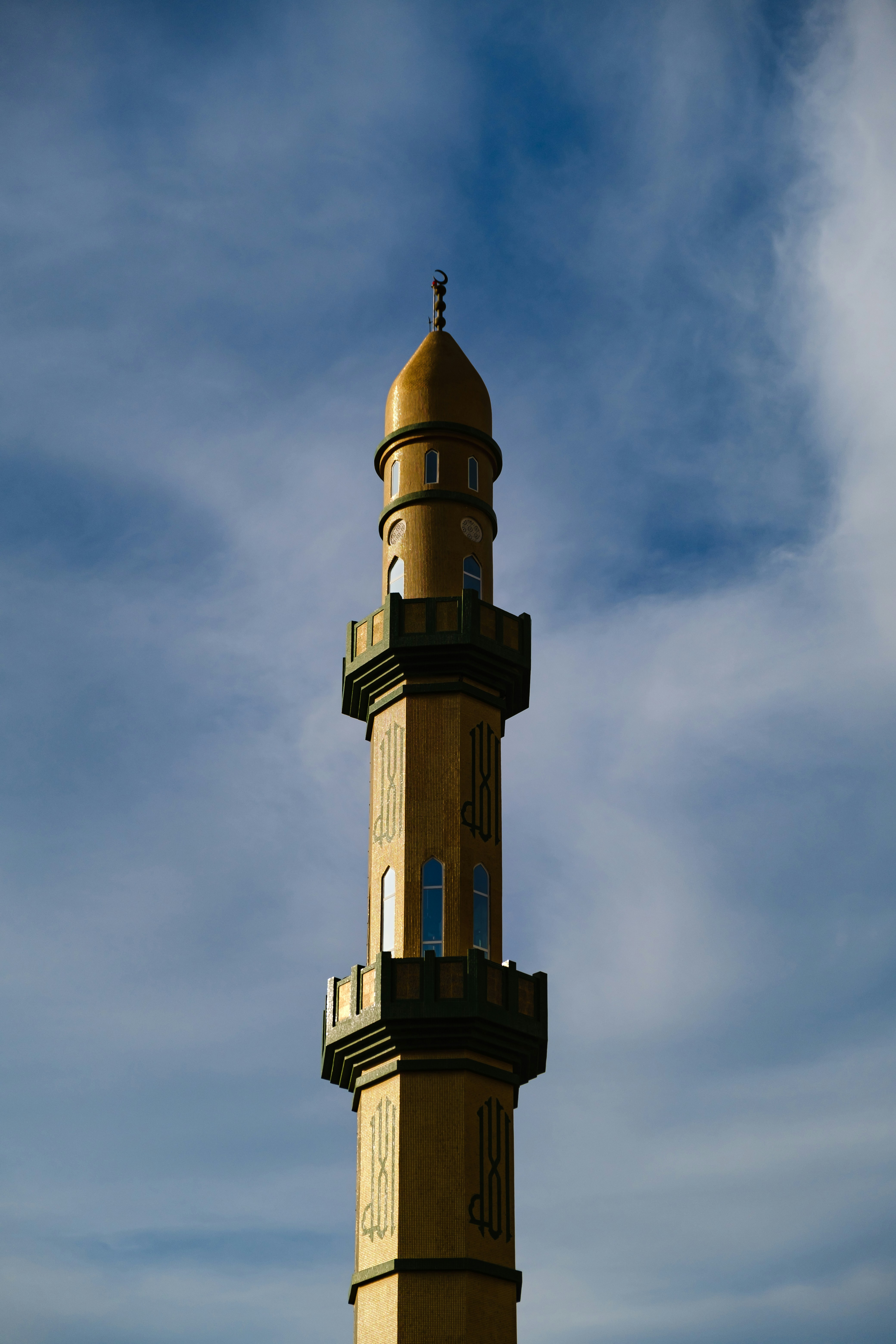 a tall tower with a clock on the top of it