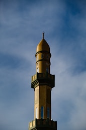 a tall tower with a clock on the top of it